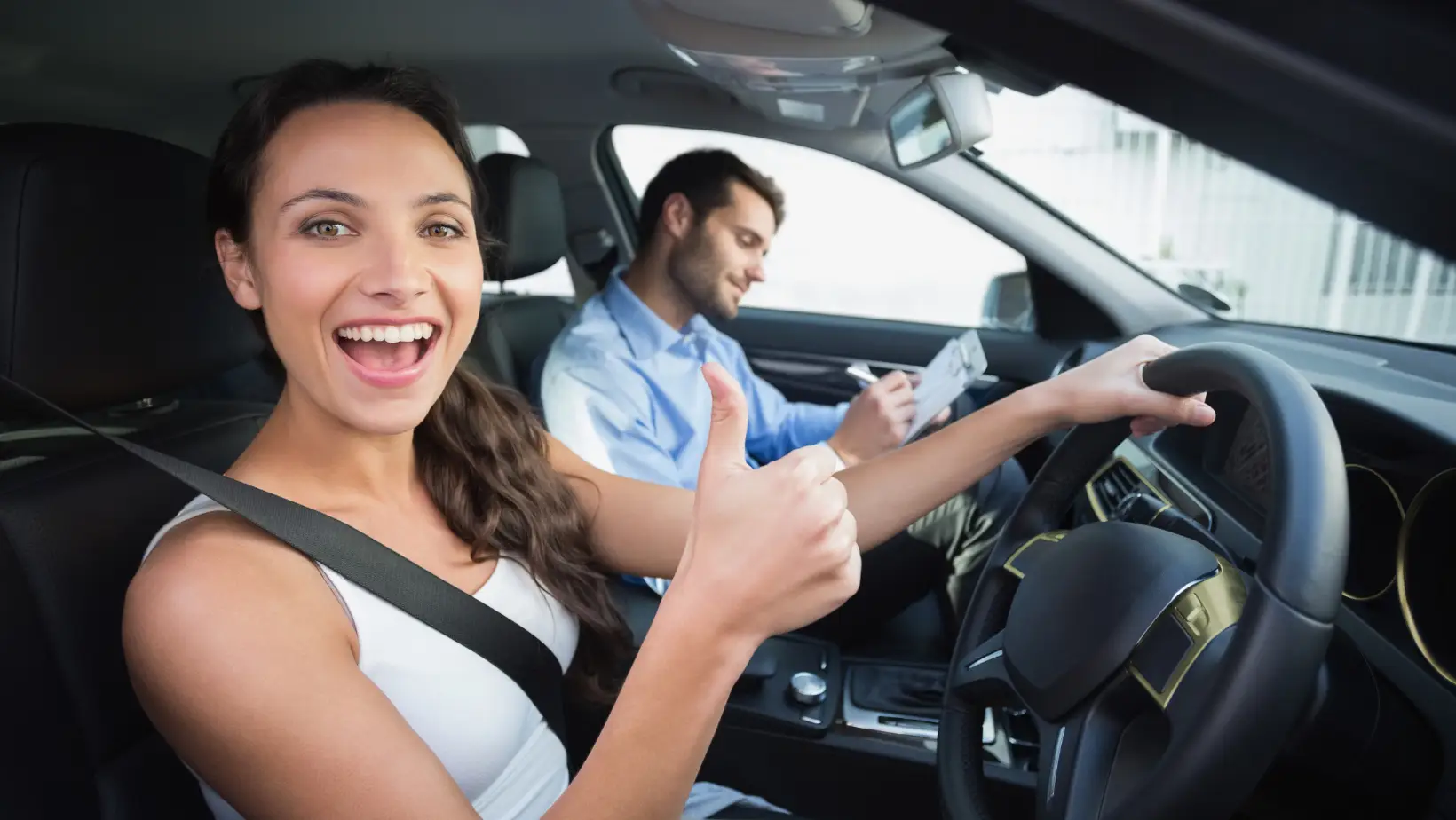 Female learner driver taking refresher driving lessons in Durban with a calm instructor guiding her through K53 maneuvers